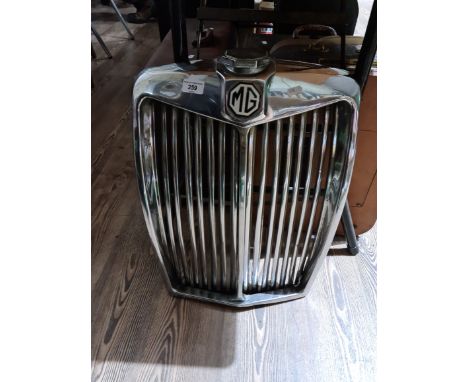 A vintage chromed radiator grill for an MG, possibly Magnette ZB model, complete with enamel black and white octagonal MG bad