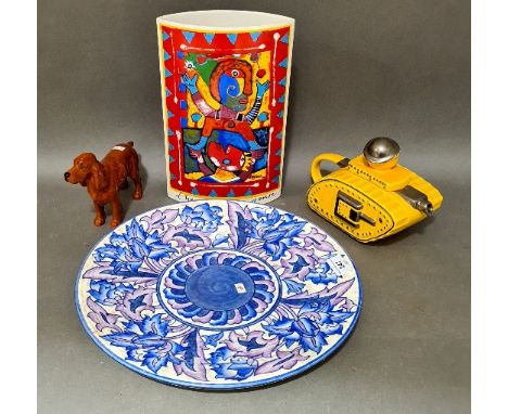 Four ceramic collectable items including Churchill tank teapot, a Beswick red Setter "Horse Show Primula", a Charlotte Rhead 