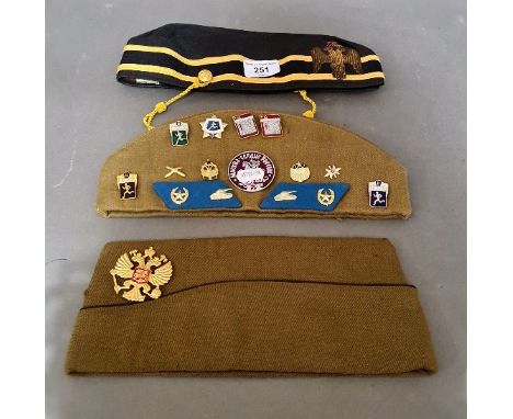 Two Russian military / pilot's caps with various badges / pins to include Imperial Russian cap badge together with a 32nd Deg