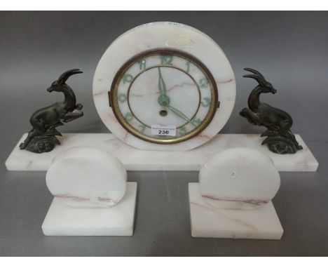 A 1930s Art Deco white marble mantle clock with garniture. 