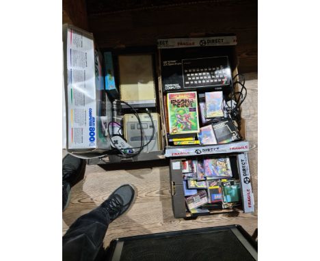 A collection of vintage computers and accessories including ZX Spectrum, games, Super Nintedo, Atari etc.