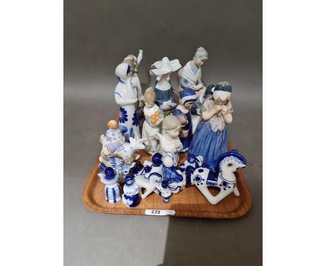 A collection of ceramic figures to include 2 Nao, 4 Lladro, 1 Tengra, 4 Royal Copenhagen and 8 Russian blue and white.Conditi