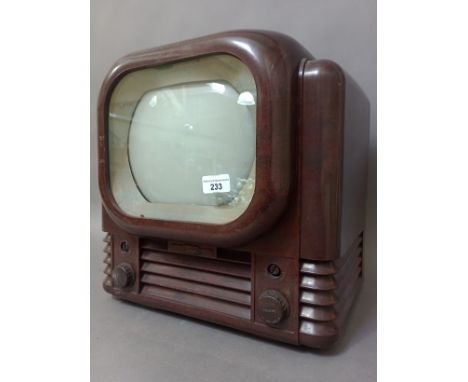 An Art Deco brown bakelite cased Bush radio television receiver, type TV22, height 38cm, width 40cm.Condition:- General wear 