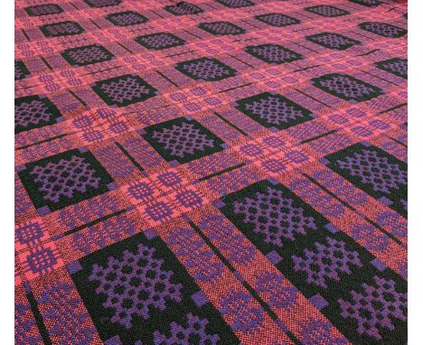 VINTAGE WELSH TAPESTRY 'CAERNARFON' BLANKET, of geometric reversible design, pink ground with purple and black details, fring