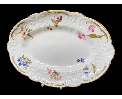 NANTGARW PORCELAIN OVAL DISH circa 1818-1820, of lobed form and typically decorated with c-scrolls, flowers and forget-me-kno
