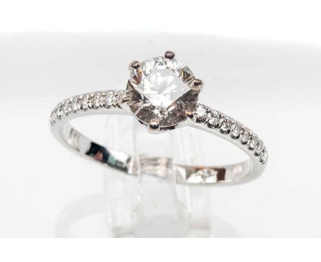 14K WHITE GOLD DIAMOND SOLITAIRE RING, the central stone measuring 1.0ct approx., having diamond set shoulders, ring size N, 