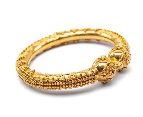 INDIAN YELLOW GOLD HINGED BANGLE with overall applied geometric ball decoration, stamped ‘22ct KDM 63’, 31.0gms      Provenan