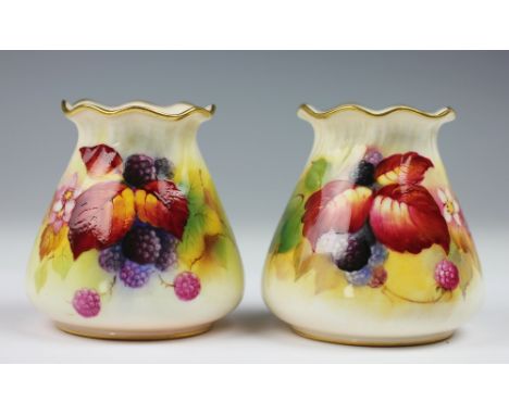 A near pair of Royal Worcester Kitty Blake vases, shape G S57 circa 1930, each enamelled with berries and autumnal leaves, si