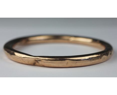 A 9ct yellow gold slave bangle, Smith and Pepper, Birmingham 1924, weight 14.5gms (at fault)