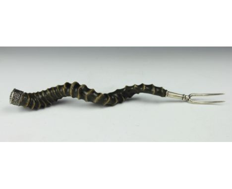 A Scottish horn mounted carving fork, 19th century, the horn mounted with white metal cap to one end and two-pronged fork to 
