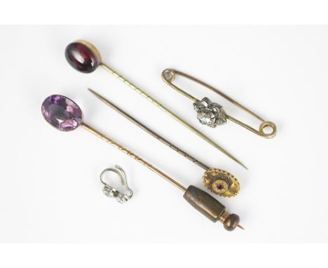 A collection of assorted brooches and stick pins, to include; a rose cut diamond flower head brooch, a diamond set drop, an a