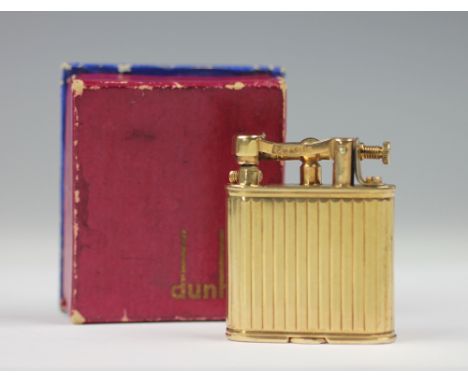 A Dunhill 9ct gold lighter, London 1951, the movement bearing 'Dunhill', with reeded detail to the body, the base stamped 'PA