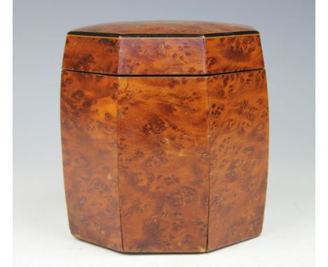 An Edwardian birds eye maple tea caddy, the octagonal shaped caddy with hinged cover lacking interior liner, 14cm high
