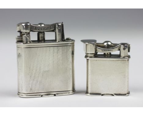 A silver Dunhill lighter, London 1929, the body with engine turned decoration, base stamped 'Pat No 143752', 4.6cm high, alon