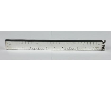A Dunhill novelty silver plated lighter in the form of a 12 inch ruler, the mount bearing 'Dunhill', the base stamped 'Dunhil