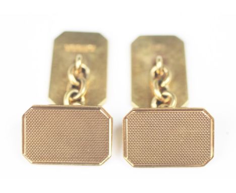 A pair of 9ct yellow gold cufflinks, 'PP Ld' Birmingham 1961, each with engine turned decoration and chain link, engraved ver