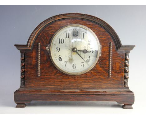 A 1920's eight day oak mantel clock, with Arabic dial and movement striking on a gong, movement possibly Gilbert, 28.5cm