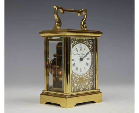 A lacquered brass time piece, the circular white enamel dial with black Roman numerals, marked 'David Peterson, England', wit