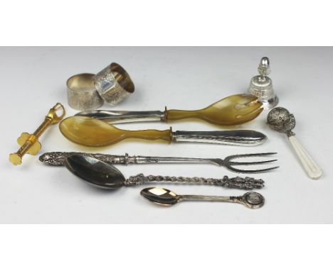 A selection of silver and plated wares, to include; a pair of silver handled salad servers, a pair of napkin rings with fern 
