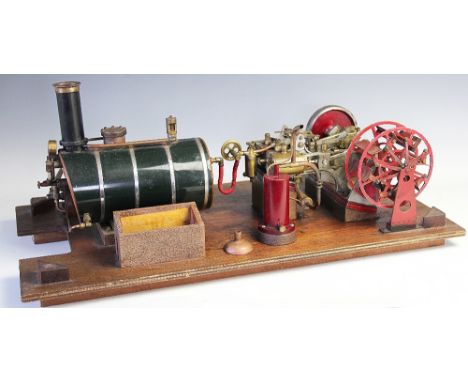 A scratch build live steam engine, with 25cm long copper cylinder and twin piston mechanism driving a belt wheel and a paddle