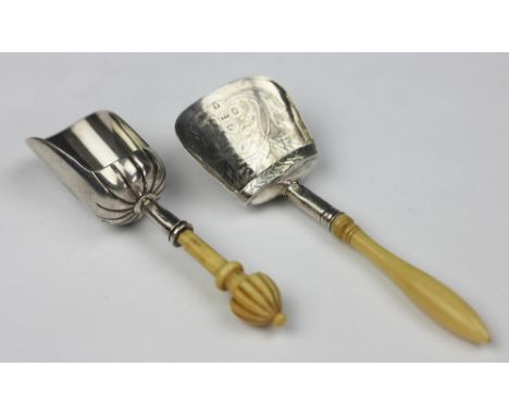 A William IV silver caddy shovel, Birmingham 1831 probably John Lawrence, with turned ivory handle, 10cm long and another sim