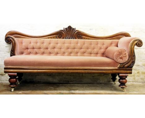 An early Victorian carved walnut chaise long, with serpentine back and scroll arm end, on turned legs and later fitted cerami