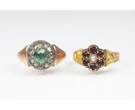 A zircon and diamond circular cluster ring, designed as a central circular zircon within a diamond set surround, all set in y