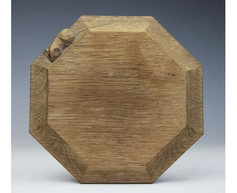 A Robert Thompson Mouseman octagonal oak cheese board, with carved mouse motif to side, 19.5cm wide