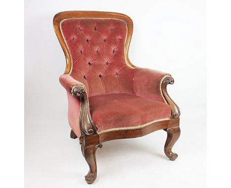 A Victorian carved walnut salon chair, with button back upholstery, on cabriole legs, 101cm H