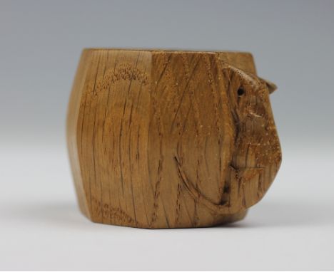 A Robert 'Mouseman' Thompson craved oak napkin ring, octagonal with carved mouse (1)