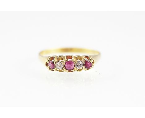 A ruby and diamond ring, early 20th century, designed as three graduated rubies and two old cut diamonds, all set in yellow g