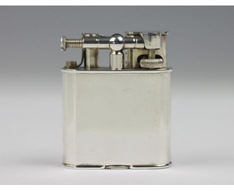 A Dunhill lighter with wind guard, of plain polished form, stamped to base 'Pat No 288806', 5cm high 