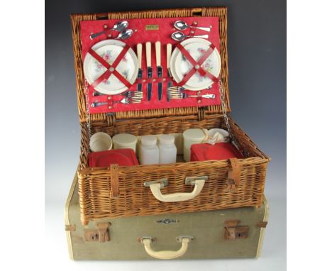 A vintage Brexton picnic hamper, enclosing a tea for two service, a 1950's vintage suitcase, and a selection of  vintage Ilfo