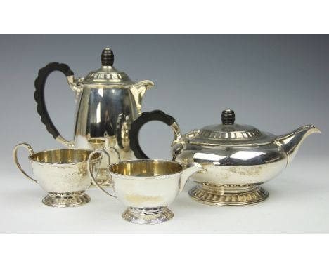 A silver four piece tea coffee service, Mappin and Webb Sheffield, 1946, each piece of stream lined form and with ebonised lo