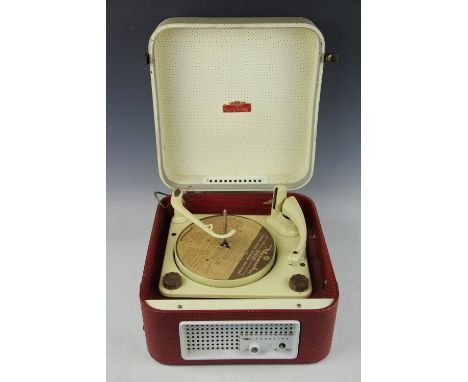  A 1950's KB Tune Time record player, BSR Monarch UA8 four speed deck within a red and white fitted case with a central pierc
