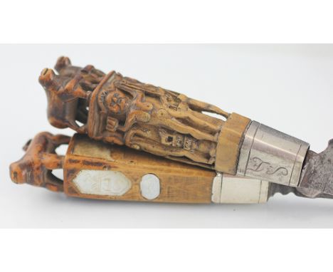 A cased travelling knife and fork, probably Dutch, 18th century, each piece with carved handles depicting figures and animals
