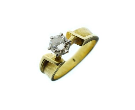 Diamond solitaire ring having an unmarked yellow metal modernist style shank, size K   Condition: 