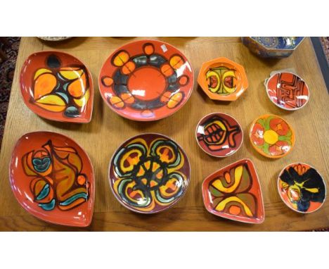 Collection of Poole Delphis range plates, dishes and saucer dishes, each with typical abstract decoration, both 1960's and 19