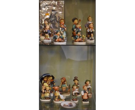 Eighteen Goebel Hummel figures comprising: Singing Lesson x 2, Wayside Harmony x 2, Lost Sheep x 2, Street Singer, We Congrat