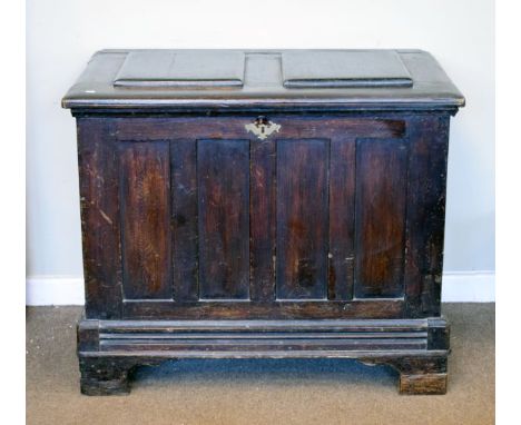 Antique oak blanket box having a fielded panelled top, blind panel front and sides and standing on bracket feet   Condition: 