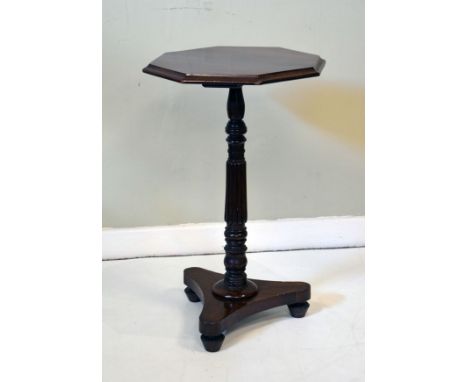 Victorian mahogany and walnut octagonal top wine table on a turned and reeded pillar and platform tripod base   Condition: 