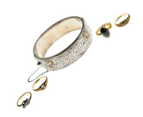 Four various gold rings together with an engraved silver snap bangle   Condition: 