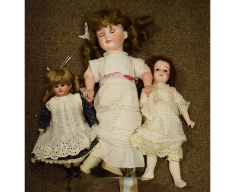 Armand Marseille bisque head doll together with two other vintage bisque head dolls   Condition: 