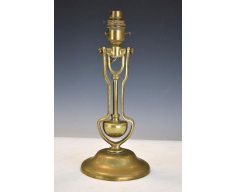 Early 20th Century brass ships table lamp having a weighted swing column and standing on a circular foot, stamped A.P.9009   