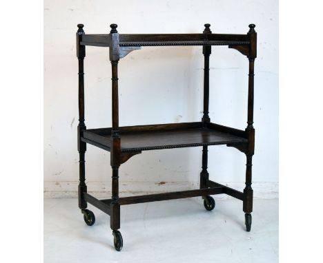 Early 20th Century oak two tier tea trolley on bobbin turned supports   Condition: 