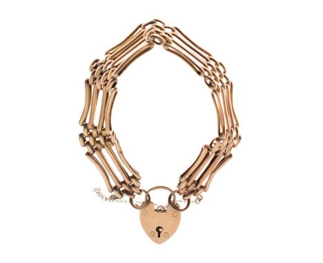 Yellow metal gate bracelet the padlock clasp stamped 9ct, 13.4g approx   Condition: 