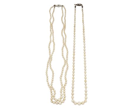 A CULTURED PEARL NECKLACE,&nbsp;a single strand of graduated cultured pearls knotted to a pierced lozenge-shaped clasp set wi
