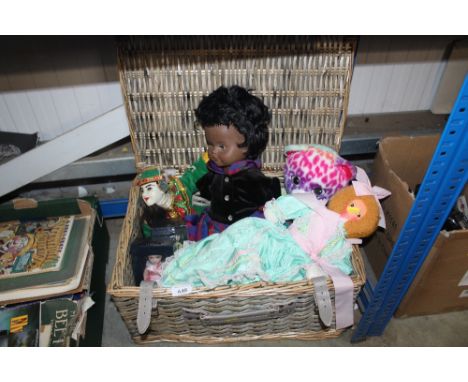 A wicker picnic hamper and contents of various souvenir dolls and others