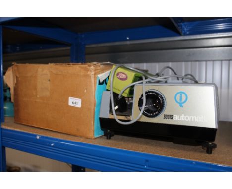 A Botts automatic projector with original box, sold as collectors item