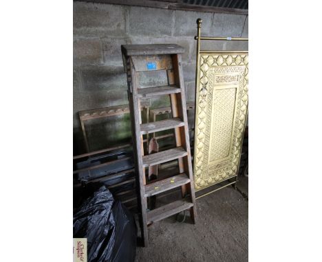 A wooden folding six step ladder
